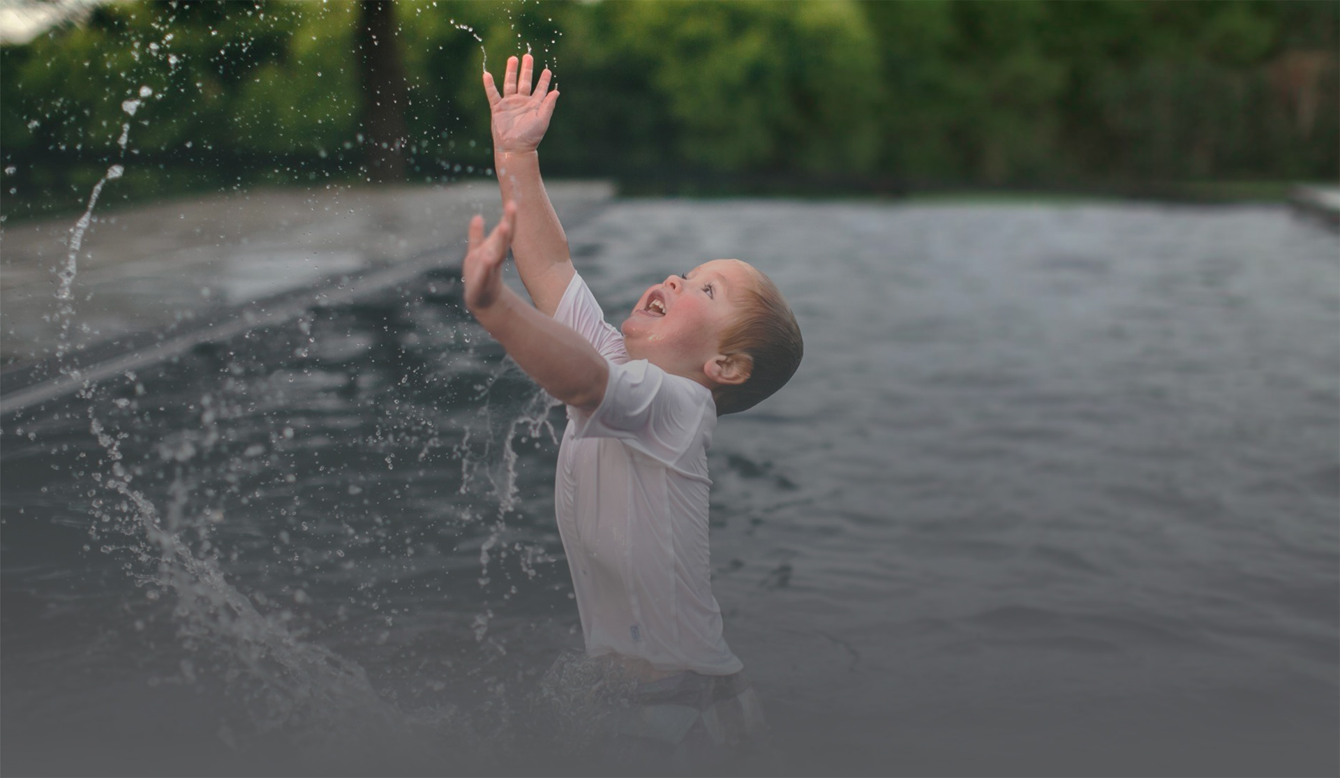 Imagine Pools Boy Playing In Pool Pool builder serving North Carolina: AquaVista Pool and Spa